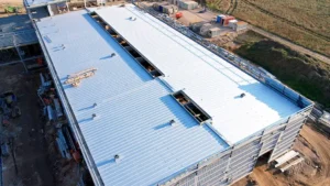 Roof Ventilation in Commercial Buildings: How to Choose Between Ridge and Slope Ventilation