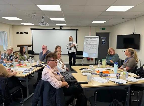Kate Whatley presenting at the Raise the Roof event
