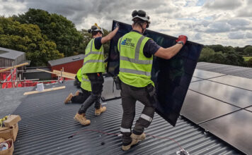 SIG Roofing Supports DIY SOS Children in Need Joshua Tree Project The team installing solar panels on the Joshua Tree extension