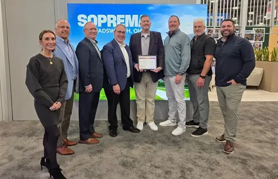 Kpost pictured accepting their award