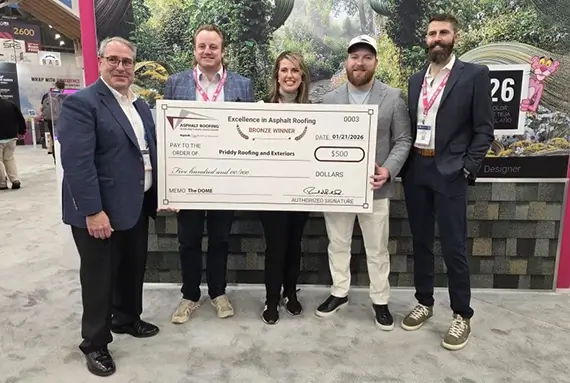 Priddy Roofing pictured accepting their award