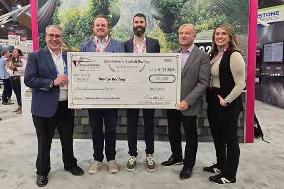 Wedge Roofing pictured accepting their award