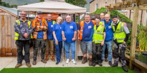Construction Charity Band of Builders Transforms Garden and Kitchen for Former Joiner