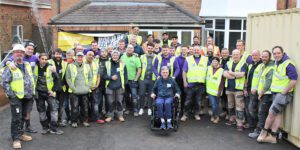 Band of Builders Completes Transformation of Home of Injured Surveyor