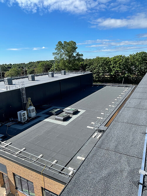 Edge protection on flat roof - Chesterfelt warm roof