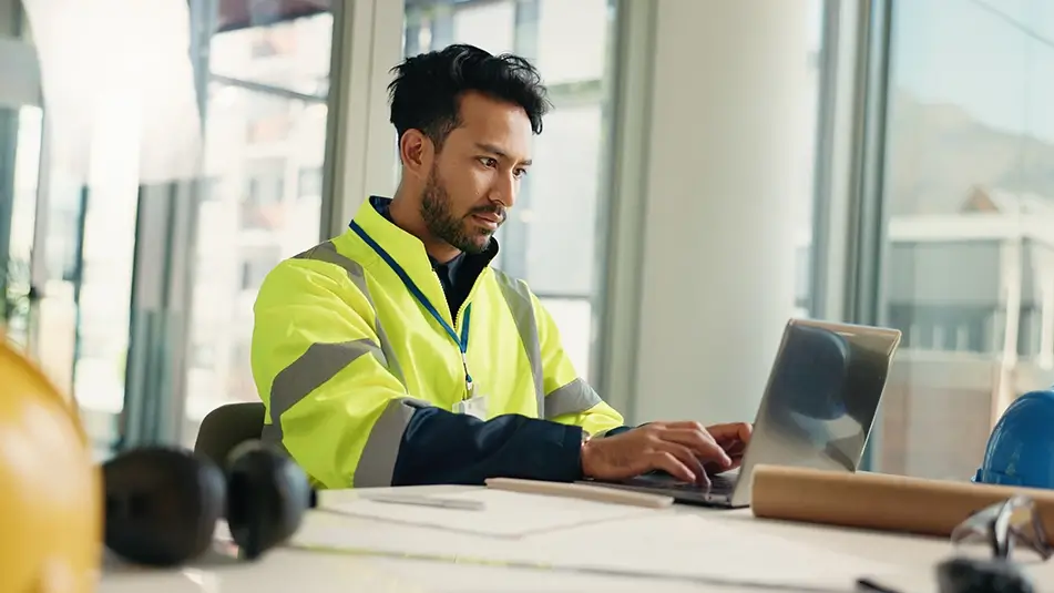 SME construction owner using computer