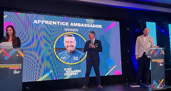 Philip Dalton accepting the award on stage