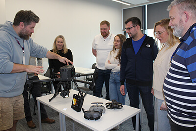 Teacher demonstrating using drones