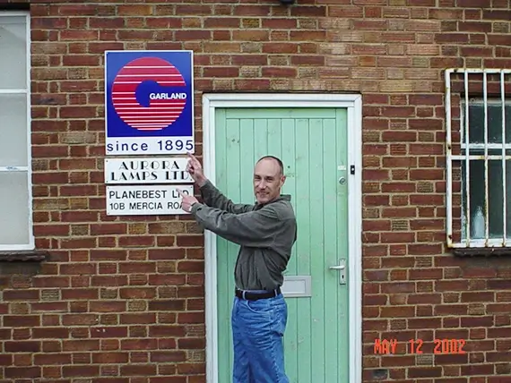 Tim Jones stands outside Garland UK's first office in 2001 