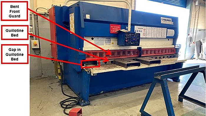 metal fabrication guillotine labelled with safety failings