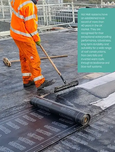 Roofer installing hot melt on roof