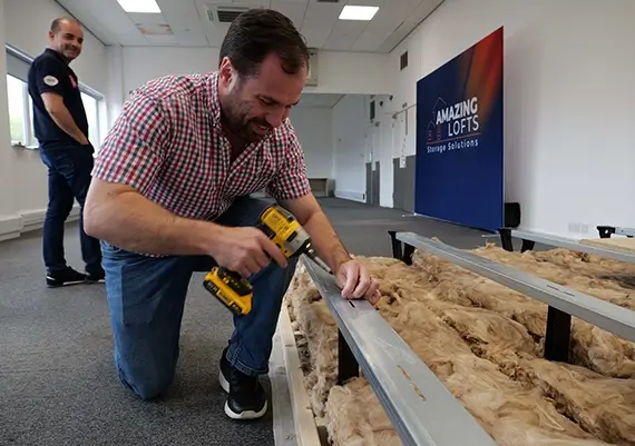 Sean Woodcock MP installing his first store floor