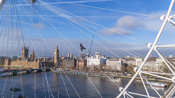 Arco worker abseiling the London Eye