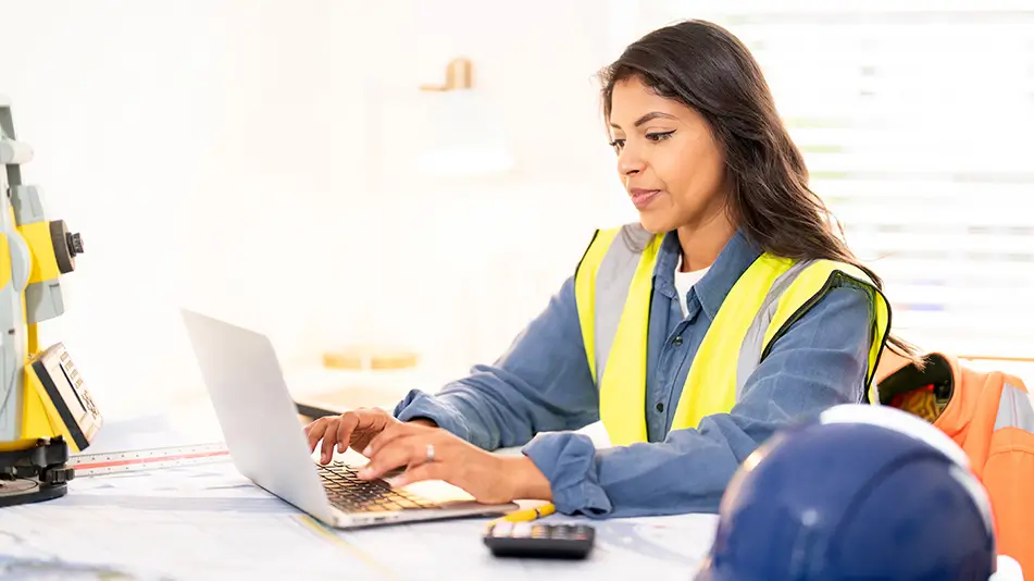 Construction worker using the computer