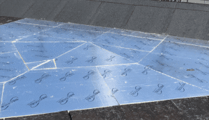 Why is a Flat Roof Cricket Recommended for Chimneys and Flat Roofs?