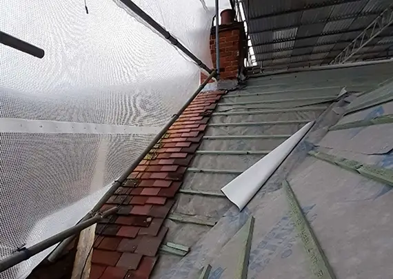 Tiling work left unfinished by the rogue roofers
