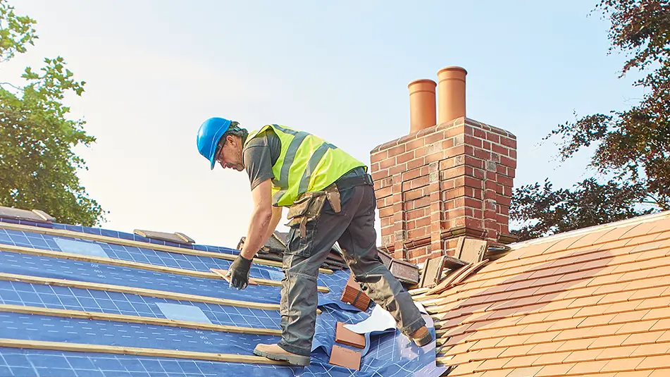 Roofer working on roof