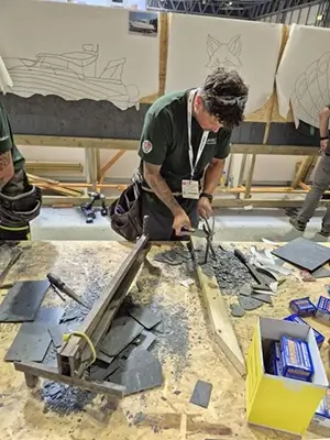 A boat being crafted with slate